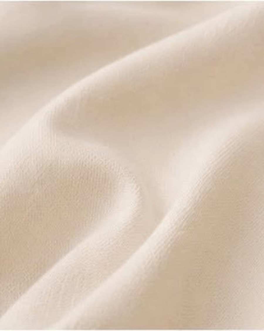 Close detail of the Blanc+ cotton-blend fabric draping in natural light